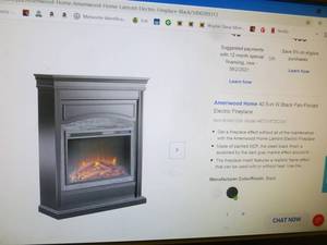 lot 3 image: Ameriwood home black electric fan forced fireplace. Appears new in box. Box was damaged in shipment. As shown.