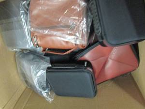 box of new toiletry bags  and cases...