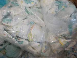 Bag of 100 or so Diapers newborn - ...