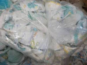 Bag of 100 or so Diapers newborn - ...