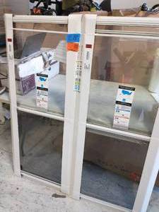 lot 28 image: LARSON 24 in. x 55 in. 2-Track Single Hung Aluminum Storm Window