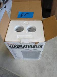 lot 68 image: CRANE 10 in. 7501500-Watt 3 Settings Electric Portable Compact Oscillating Ceramic Space Heater