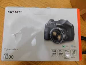 lot 18 image: Sony Cyber-shot 20.1MP HD 35x Zoom Digital Camera - Black, DSCH300B