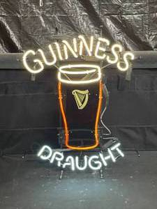 lot 63 image: Guinness Draught neon with pint glass