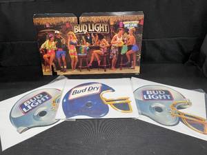 lot 111 image: Bud Light poster and NFL football helmet signs