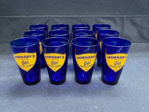 lot 129 image: Hornsbys Draft Cider, Libby brand cobalt blue glasses, NIB
