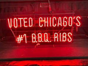 lot 54 image: Voted Chicagos #1 BBQ Ribs neon sign
