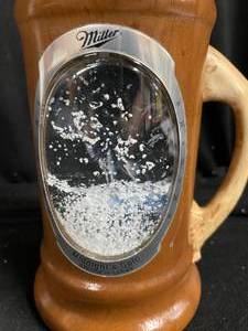 lot 290 image: Schmidts stag handled mug with snowglobe effect.Wolf, 2nd in the series..