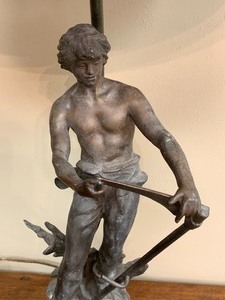 Vintage LampFigurine of a Man Sharpening a Sickle