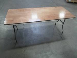 lot 89 image: Table With Folding Legs, Approximate Dimensions 72 x 29 12 x 30 12 Tall. - Top is Scratched.