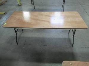 lot 90 image: Table With Folding Legs, Approximate Dimensions 72 x 29 12 x 30 12 Tall. - Top is Scratched.