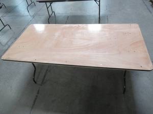 lot 93 image: Table With Folding Legs, Approximate Dimensions 72 x 35 12 x 30 12 Tall. - Top is Scratched.