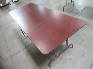 lot 98 image: Table With Folding Legs, Approximate Dimensions 48 Dia. x 30 12 Tall. - Top is Scratched has Corner Damage.