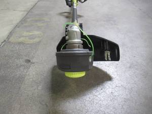 lot 31 image: Ryobi 40-Volt X Lithium-Ion Cordless Attachment Capable String Trimmer RY40205BTL
