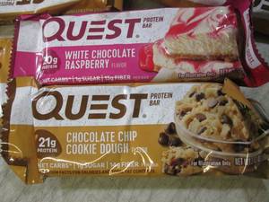 lot 152 image: (B-1) 25 Quest Protien Bars Past Da...