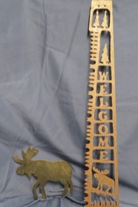 lot 46 image: SAWBLADE DESIGN CUT OUT WELCOME SIGN. CUT OUT METAL MOOSE