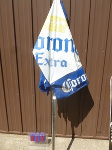lot 10 image: Corona vinyl patio umbrella. Good used condition.