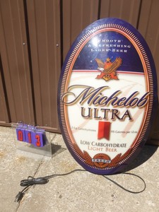 lot 13 image: Michelob Ultra lighted sign. 37 x 23. Very nice condition. Has 2003 date on it. As shown.