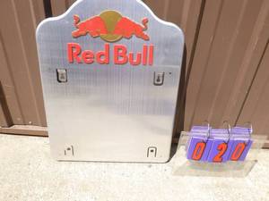 lot 20 image: Red Bull Aluminum sign. 24 x 18. Not sure if something is missing This is all we have. As shown.
