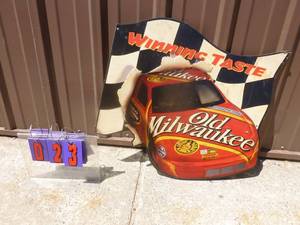 lot 23 image: Old Milwaukee Nascar tin sign. 24 x 24. Could use a good cleaning. Otherwise nice shape. As shown.