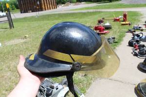 lot 681 image: Kevlar Fire Helmet Black with logo Baldwin TWP N.E. Sherburne  with Clear Face Shield and Neck Flap
