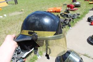lot 683 image: Kevlar Fire Helmet Black with logo Baldwin TWP N.E. Sherburne  with Clear Face Shield and Neck Flap