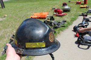 lot 684 image: Kevlar Fire Helmet Black with logo Baldwin TWP N.E. Sherburne  with Clear Face Shield and Neck Flap
