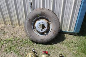 lot 687 image: General Grabber AW LT23585R16 MS 1201160 Tire  with 16 8-lug Rim