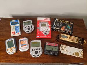 lot 64 image: (9) Vintage Handheld Video Games