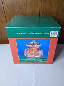 lot 209 image: 9.75 Musical Lighted Animated Carousel