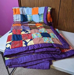 lot 297 image: Handmade Quilt with Purple Trim