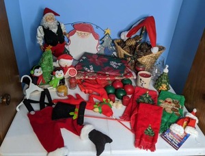lot 390 image: Christmas Decor Hand Towels, Tablecloths, Candles, Dancing Santa, etc.