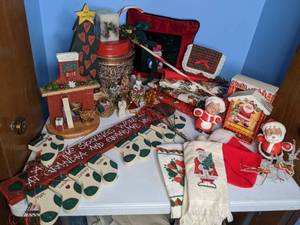 lot 391 image: Christmas Decor Wall Hangings, Tins, Hand Towels, Tablecloths, Candles, etc.