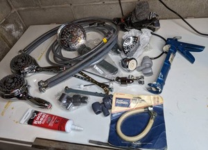 lot 256 image: Shower Heads, Caulk & Gun, Steel Wool, Misc. Plumbing Supplies