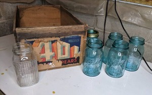 lot 263 image: Vintage Wood Pear Crate with Large Blue Mason Jars