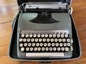 lot 231 image: Vintage Smith and Corona Typewriter with Case