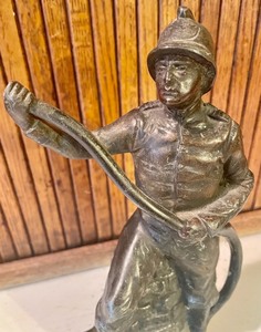 lot 163 image: Metal Fireman Statue