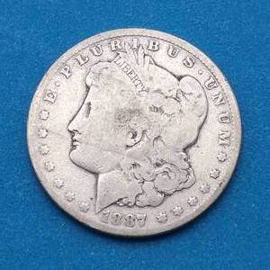 lot 14 image: 1887-O Morgan Silver Dollar