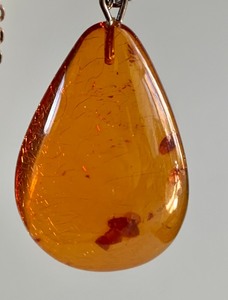 lot 299 image: Amber Tear Drop Shaped Pendant on Sterling Chain
