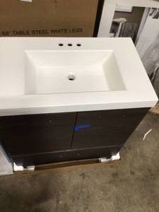 lot 11 image: Mix lot of assorted bathroom sinks and vanitys (some have damages) Customer returns see all pictures