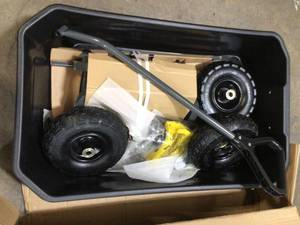 lot 40 image: Gorilla Cart 4 cu. ft. Poly Garden Dump Cart in good condition see all pictures