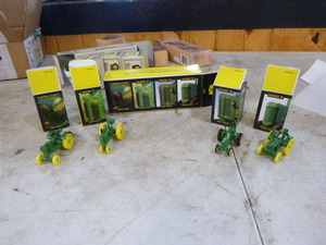 lot 124 image: Ertl John Deere Historical 4 Piece Toy Set