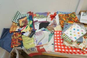 lot 32 image: Seasonal tableclothsflags