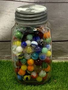 lot 21 image: 7 Tall Antique Jar of Marbles