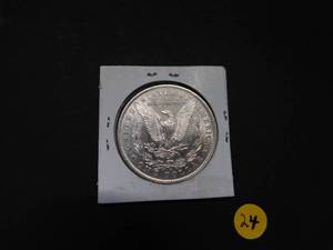 1883-O AU Morgan Silver Dollar Marked MS65 when purchased
