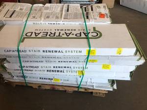 lot 32 image: Sorted pallet of Cap A Tread vinyl overlay for stairs -24 cases-  mixed sizes & colors - see pictures