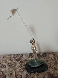 lot 23 image: Malcom Moran Bronze Boy with Kite Sculpture