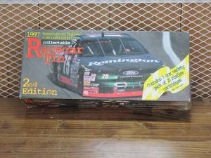 lot 22 image: Race Car Tin Collectable - 1997 Remington Bullet tin - TIN & BOX ONLY