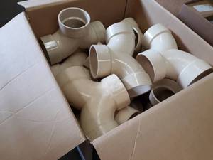 lot 2010 image: Lot of (13) 4 Double 90° Sch40 DWV PVC Pipe Fittings
