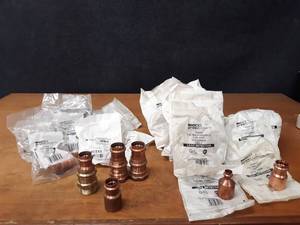 lot 2091 image: NIBCO PressSystem Copper Fittings - (10) 1-14 Press x Female Pipe, (2) 1-14 Press x 1-12 Female Pipe, (1) 1 Press x 1-12 Female Pipe, (10) 1-12 x 12 Coupler, (5) 1-12 x 1 Couplers